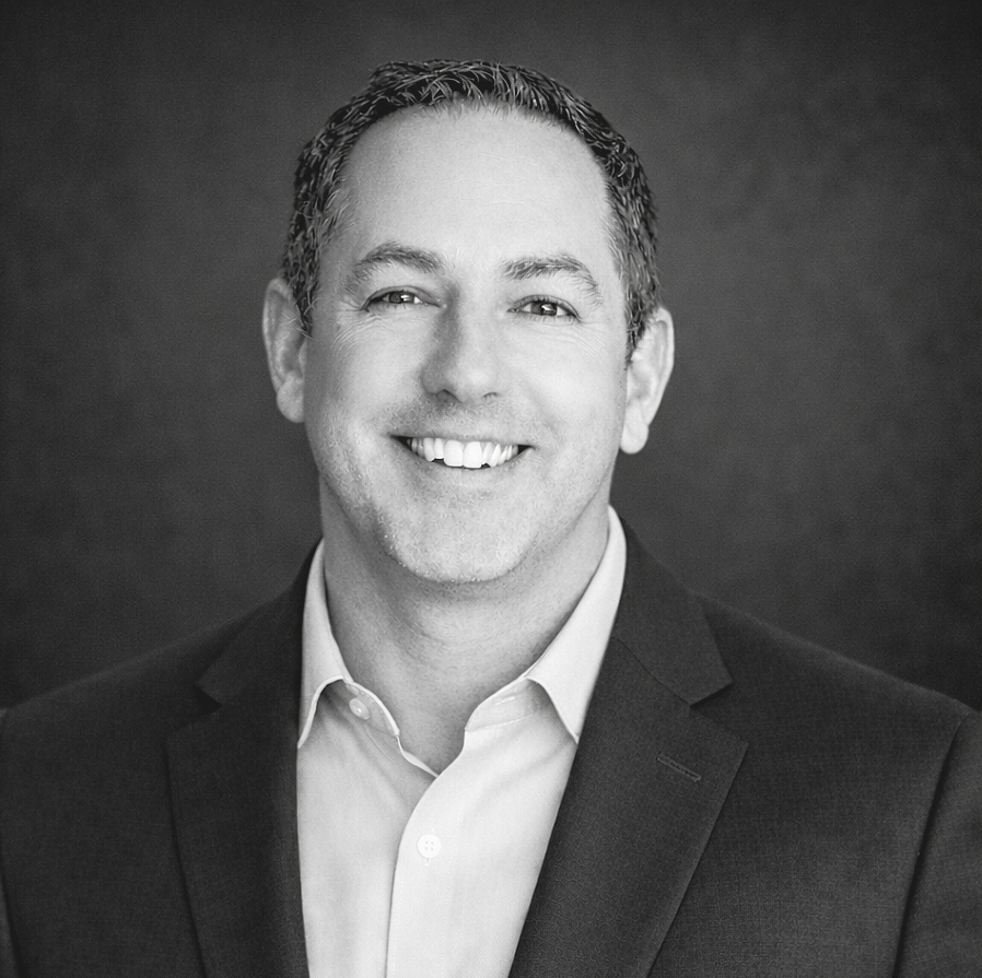 Corey Reid evolve exterior calgary photo of corey reid in a professional suit